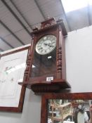 A mahogany wall clock.