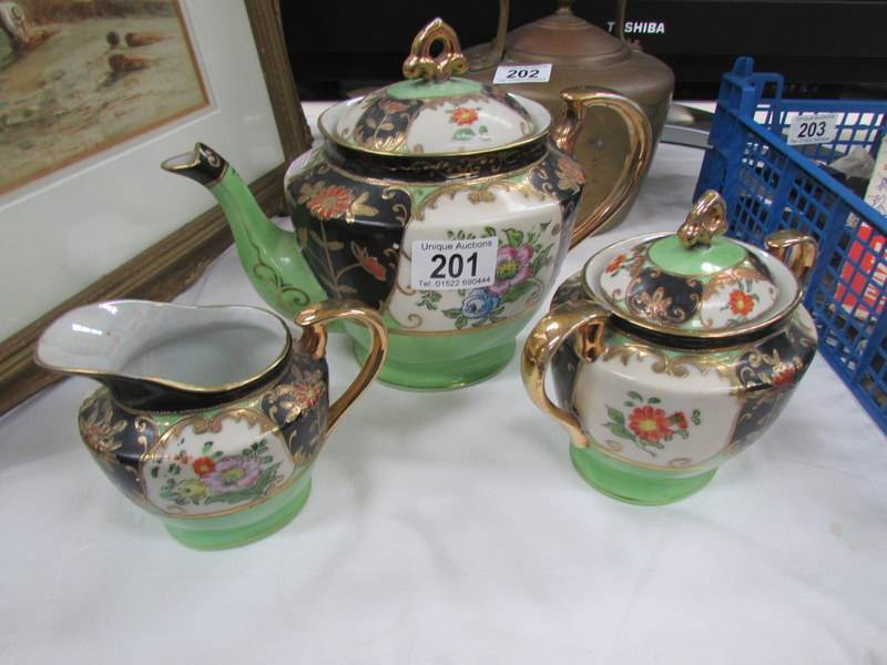 A 3 piece Japanese porcelain tea set.