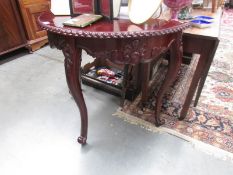 A mahogany D shaped hall table.