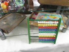 2 sets of old wooden building blocks and an abacus.