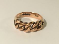 An antique rose gold ring in a plaited design, hall marked London 1902, size K half.