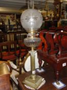 A brass Corinthian column oil lamp with Hinks burner and cut glass font.