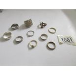 10 assorted rings including some silver.