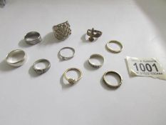 10 assorted rings including some silver.