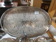An oval silver plate tray.