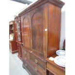 A Victorian mahogany linen press.