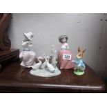 2 NAO girl figures, a NAO geese group and a Beswick Beatrix Potter Peter Rabbit.