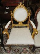 A gilded arm chair.