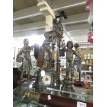 A 3 piece clock garniture surmounted figures,.