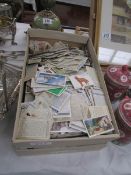 A box of approximately 2000 assorted cigarette cards from a variety of manufacturers including