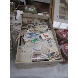 A box of approximately 2000 assorted cigarette cards from a variety of manufacturers including