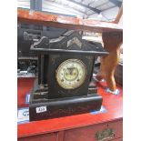 A black slate/marble clock.