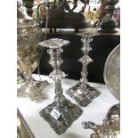 A pair of silver plate candlesticks.