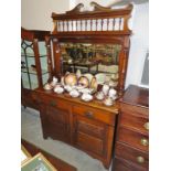 A mahogany mirror backed sideboard.