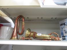 A brass bugle together with a brass and copper bugle with Royal Artillery badge, a/f,