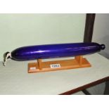 A Bristol blue glass rolling pin.