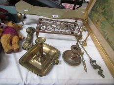 A mixed lot of brass ware including trivets, candlesticks. toasting fork etc.