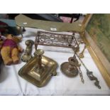 A mixed lot of brass ware including trivets, candlesticks. toasting fork etc.