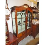 A mahogany astragal glazed corner cabinet.