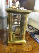 A brass carriage clock.