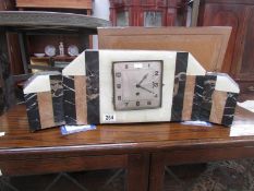 A 3 piece onyx and marble clock garniture.