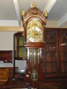 A Wall clock, triple weight, 8 day mechanical movement, bass, arch dial, moon roller, 12" dial,