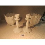 A pair of white Coalport planters and a pair of white Coalport candlesticks.