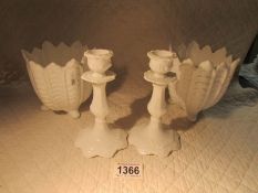 A pair of white Coalport planters and a pair of white Coalport candlesticks.
