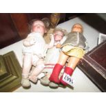 A porcelain doll marked Revalo, Germany and 2 other dolls.