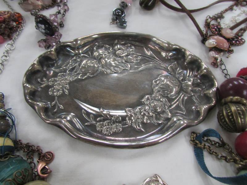 A mixed lot of necklaces, bracelets etc and an embosses white metal tray. - Image 3 of 3