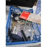 A quantity of military memorabilia including photographs, cloth badges, buttons,