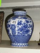 A blue and white vase.