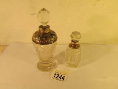 2 silver topped perfume bottles.