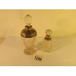 2 silver topped perfume bottles.