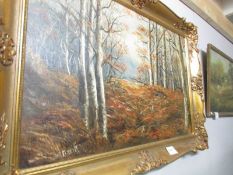 A gilt framed oil on canvas woodland scene signed D A Everitt.