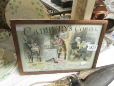 A framed and glazed Cadbury's cocoa advertisement.