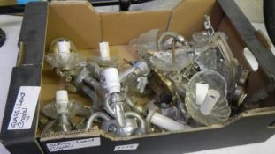 A box of glass wall light parts.