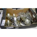 A box of glass wall light parts.