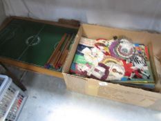 A collection of football memorabilia including rosettes,