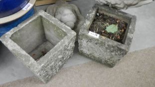 A pair of old square garden pots.