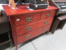 A 2 over 2 mahogany chest of drawers.
