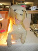 A vintage straw filled dog (needs a little tlc).