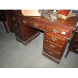 A double pedestal mahogany desk.