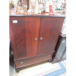 A mahogany effect TV cabinet.