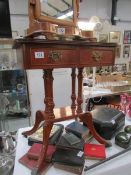 A 2 drawer mahogany effect occasional table.