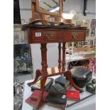 A 2 drawer mahogany effect occasional table.