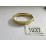 A 9ct gold bangle, 17.9 grams.