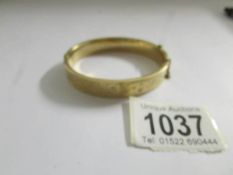 A 9ct gold bangle, 17.9 grams.