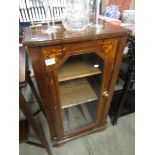 A mahogany music cabinet.