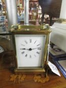 A brass carriage clock.